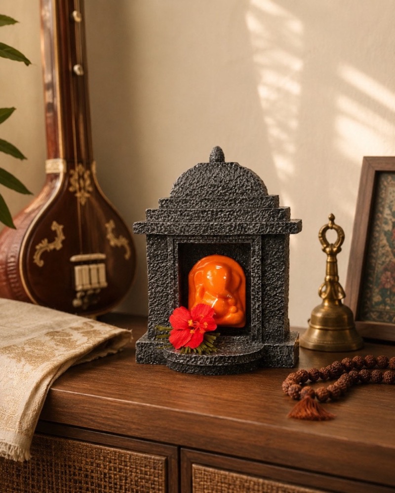 The temple standing on a wooden cabinet at home.